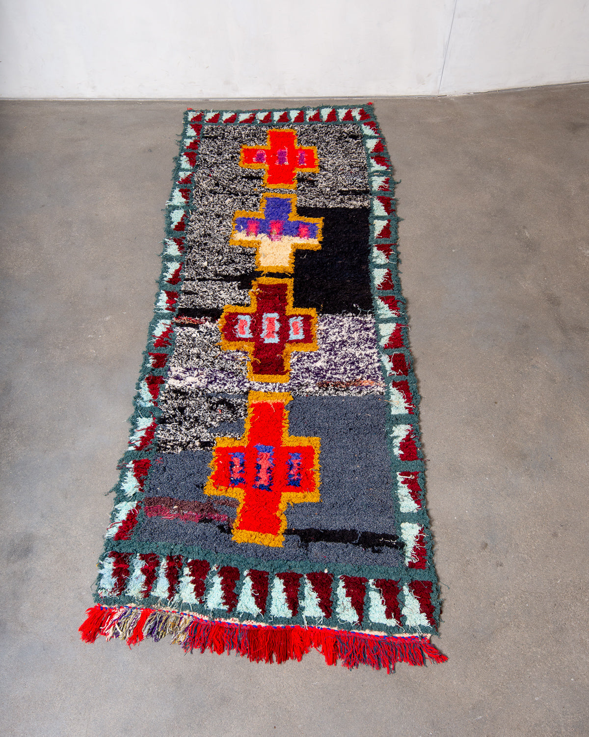 Modern designer vintage handcrafted Berber rug from Morocco. Boucherouite runner rug with beautiful colors and patterns.